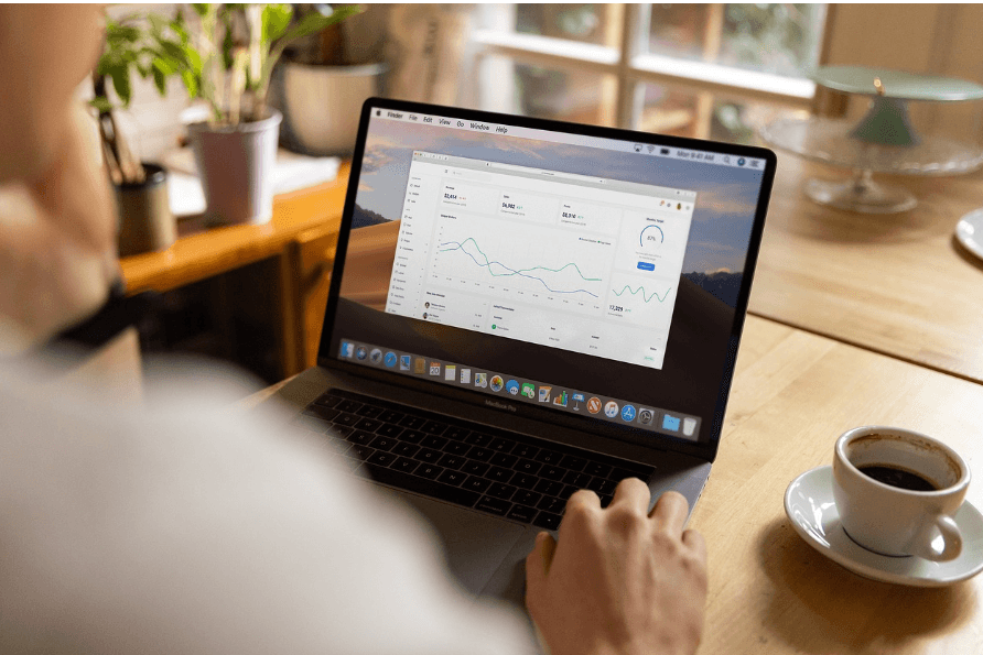 Remote worker looking at laptop while at home