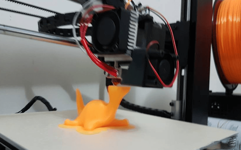 3D Printer printing a dinosaur
