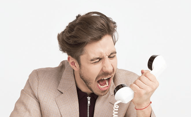 person yelling into phone